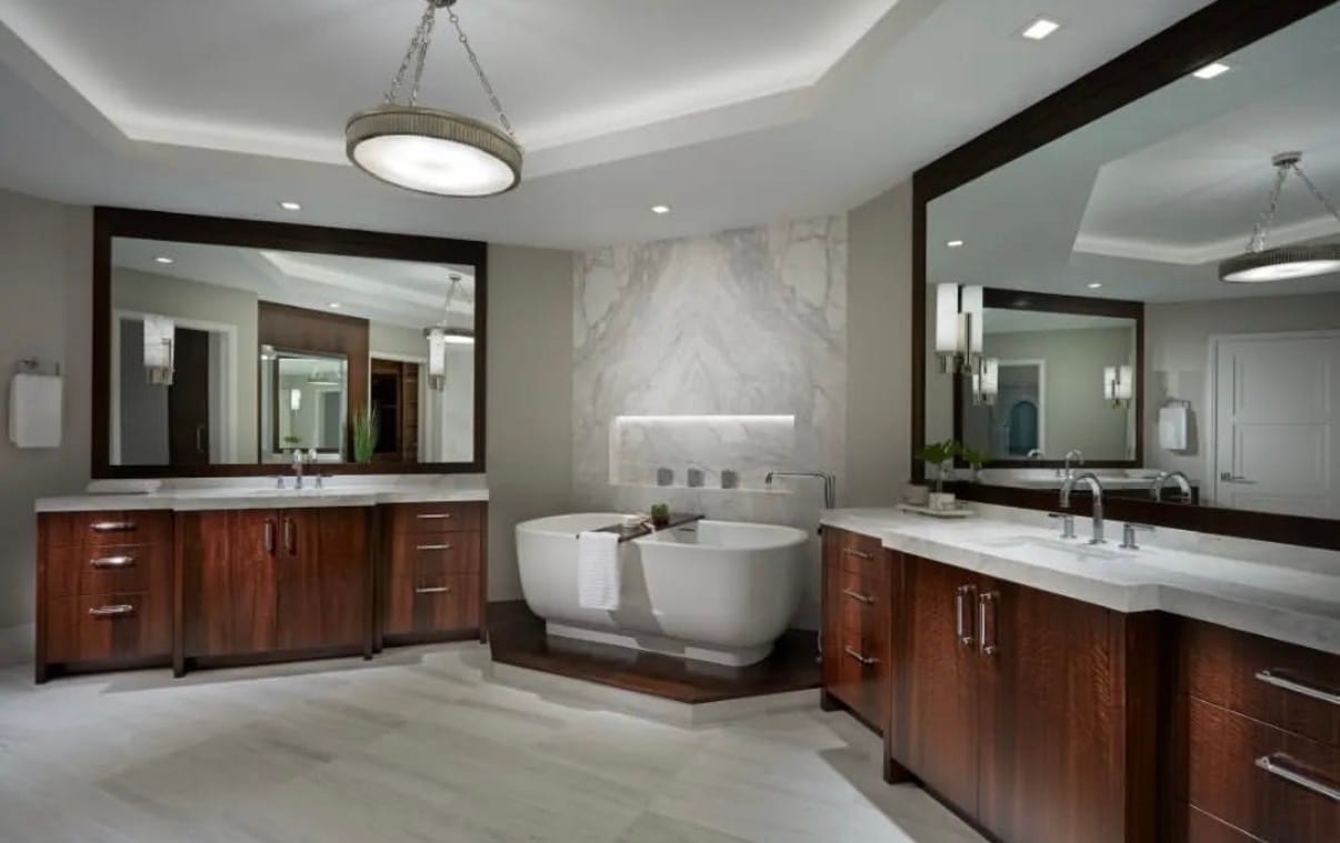 A contemporary bathroom finished in fumed quartered curly eucalyptus veneer, the figure running through the cabinetry