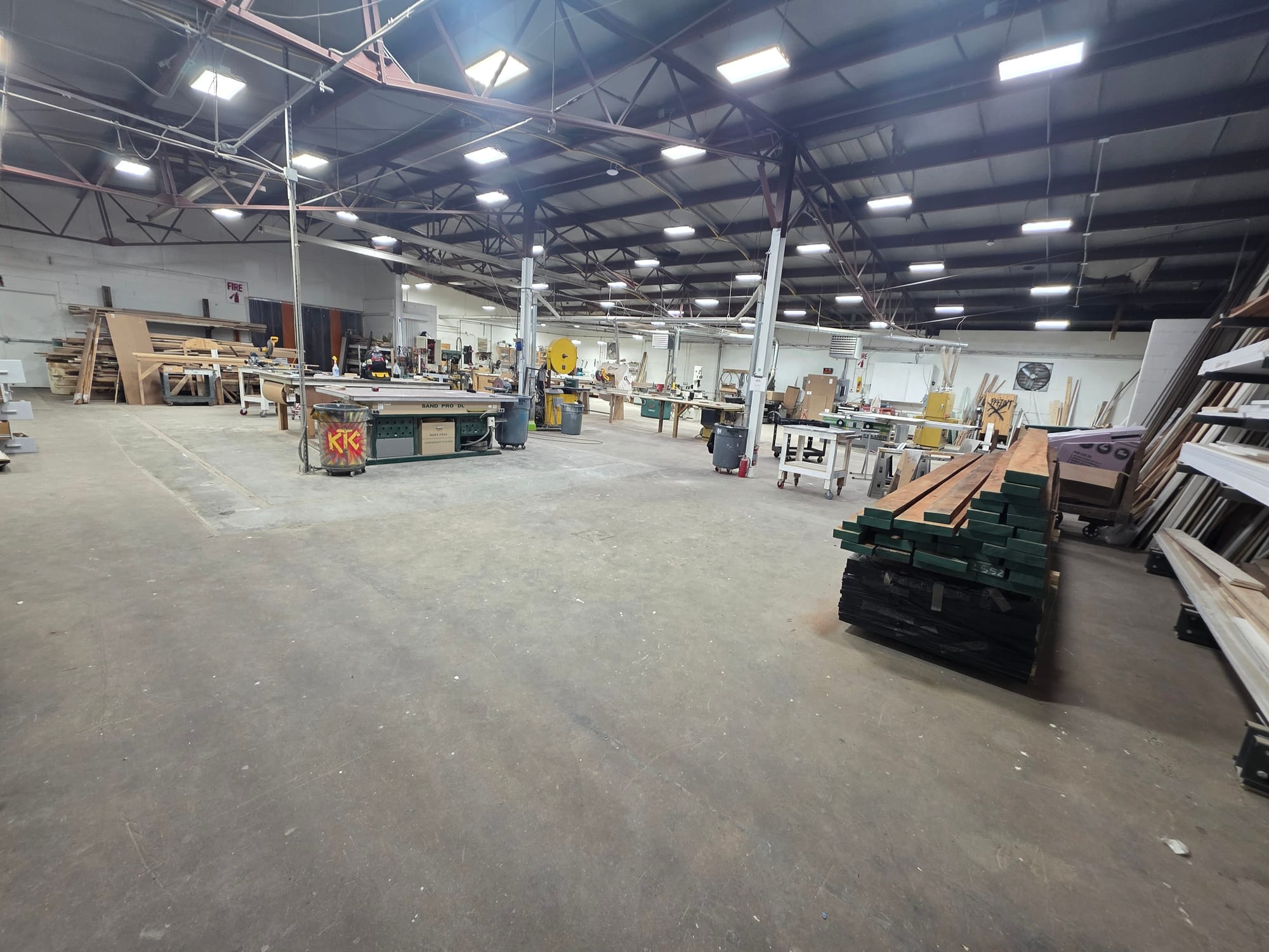 The Rosebud Veneer shop floor, with benches, presses and racked material running the length of the building
